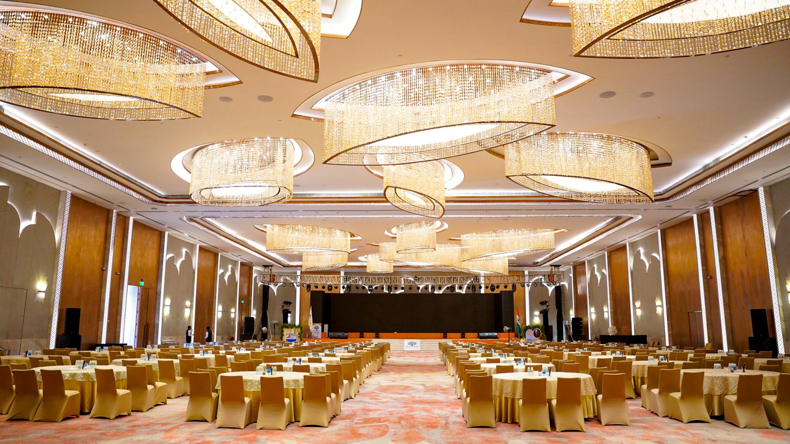 Large conference room with structured seating and a full-width stage