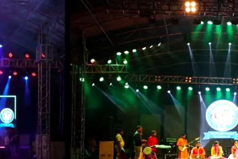 Kalamanch live stage with green lighting and performers