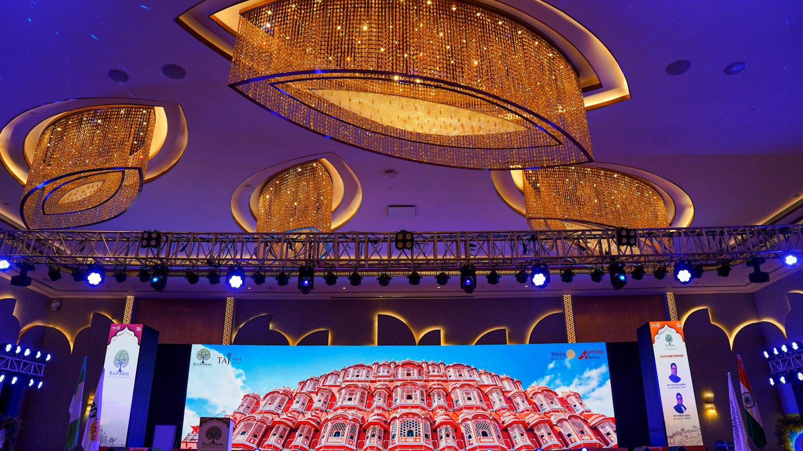 Wide LED stage with professional truss and blue show lighting